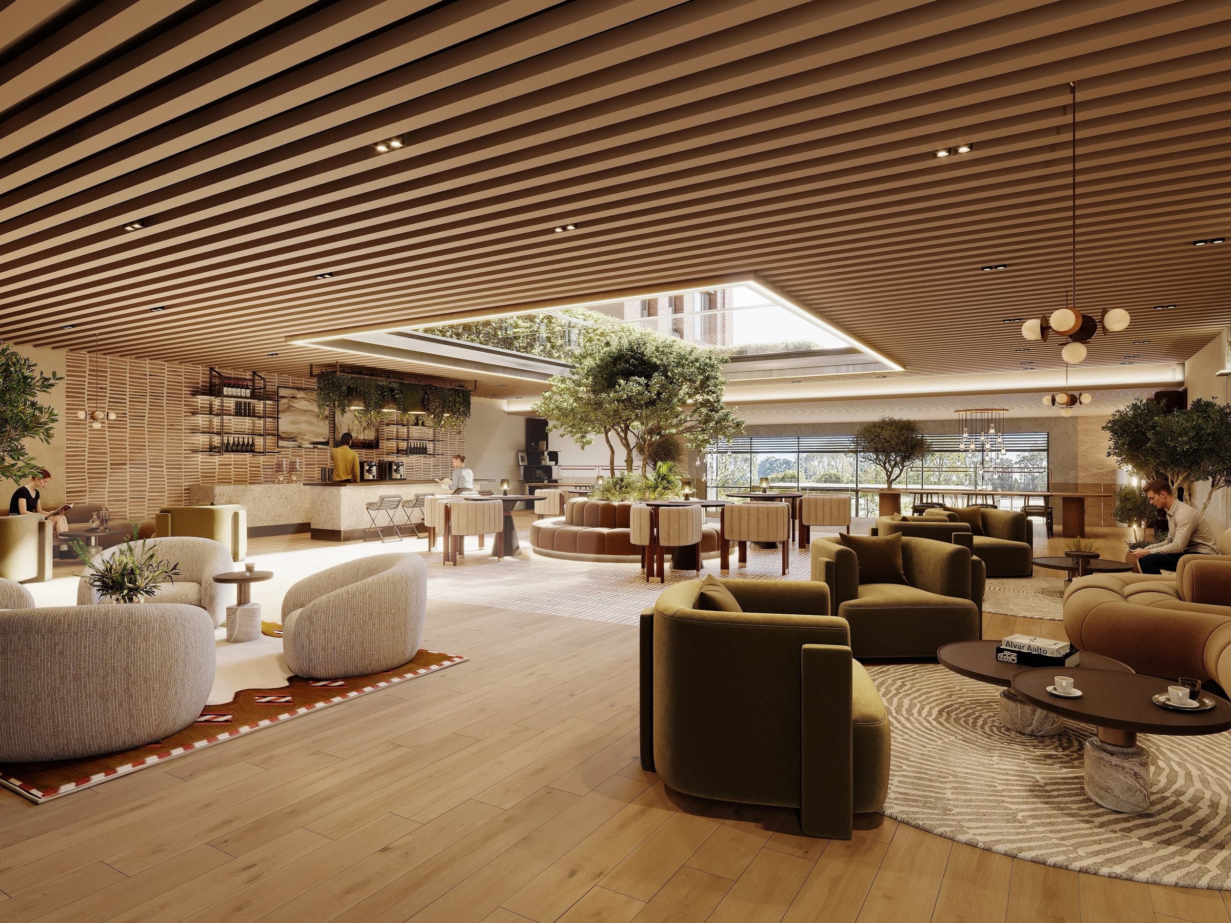 Residents' lounge with soft seating and a planted atrium